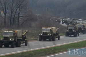 Long military armament convoy